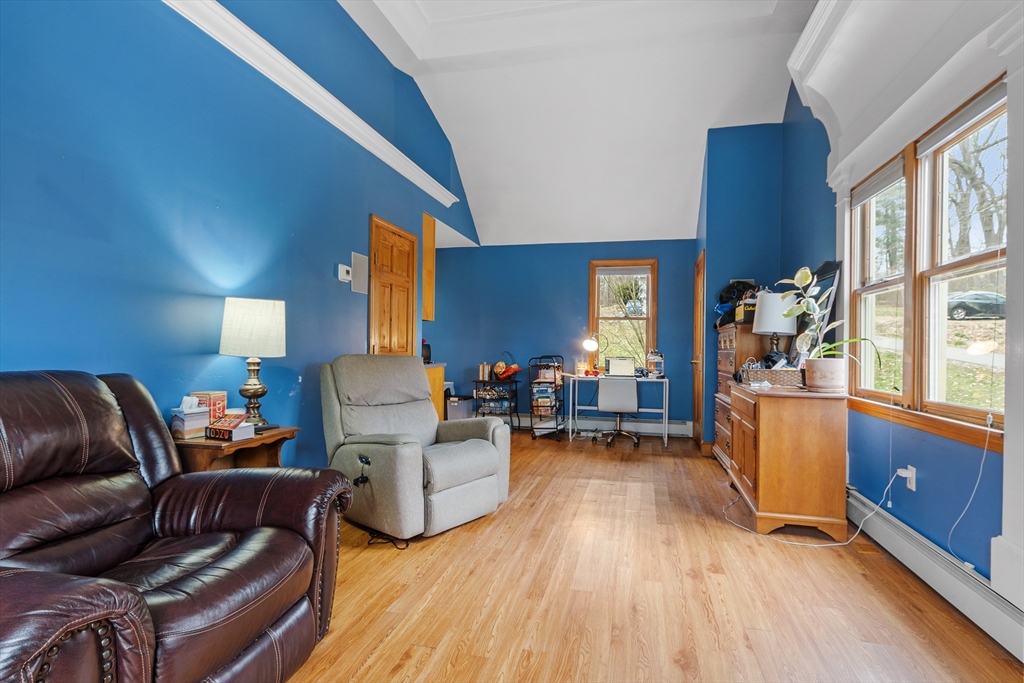 76 Woobly Road Bolton, MA 01740 - Photo 23 of 27 a living room with furniture and a wooden floor