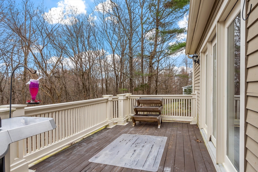 76 Woobly Road Bolton, MA 01740 - Photo 27 of 27 a view of house with deck and outdoor seating