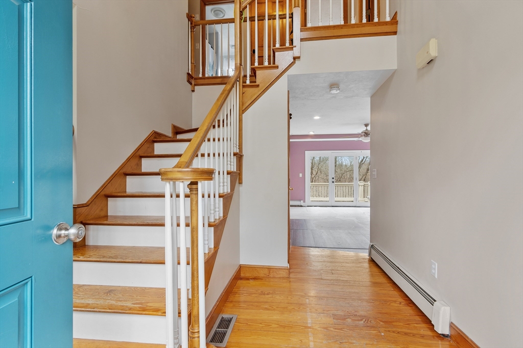 76 Woobly Road Bolton, MA 01740 - Photo 3 of 27 a view of staircase with white walls and white walls