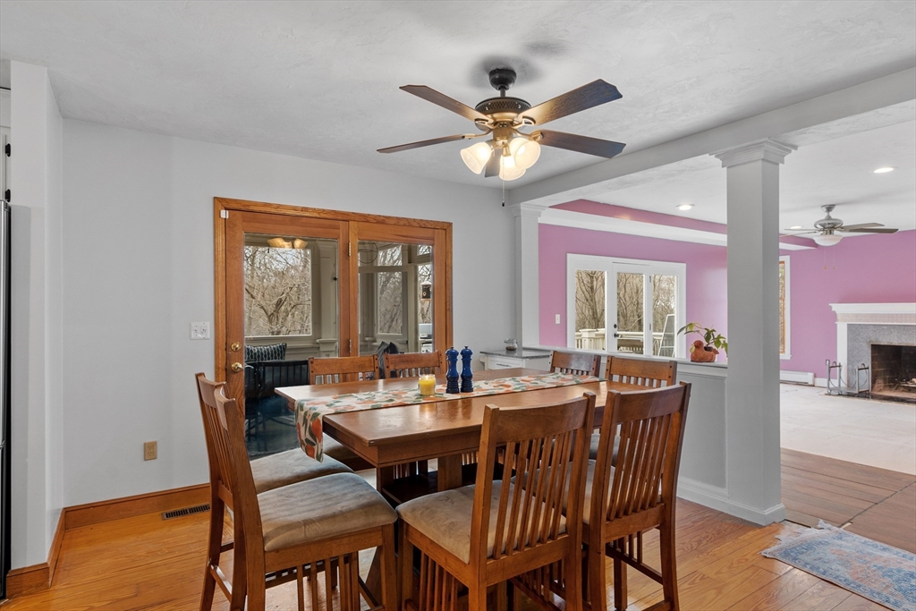 76 Woobly Road Bolton, MA 01740 - Photo 8 of 27 a view of a dining room with furniture window and wooden floor