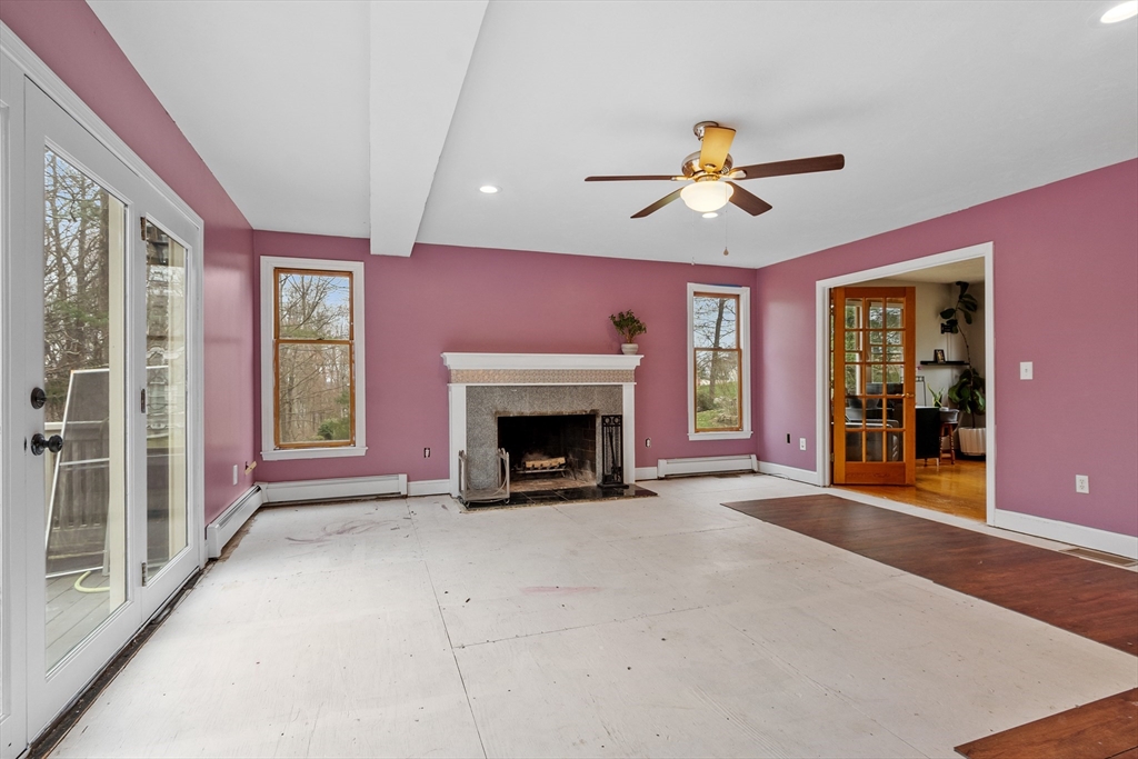 76 Woobly Road Bolton, MA 01740 - Photo 10 of 27 a view of an empty room with window and fireplace