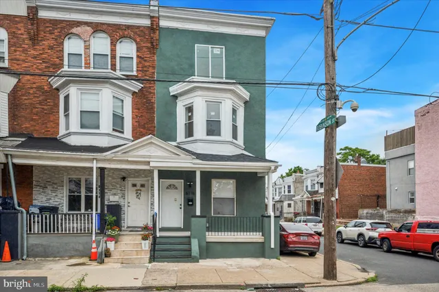 a front view of a house with parking space