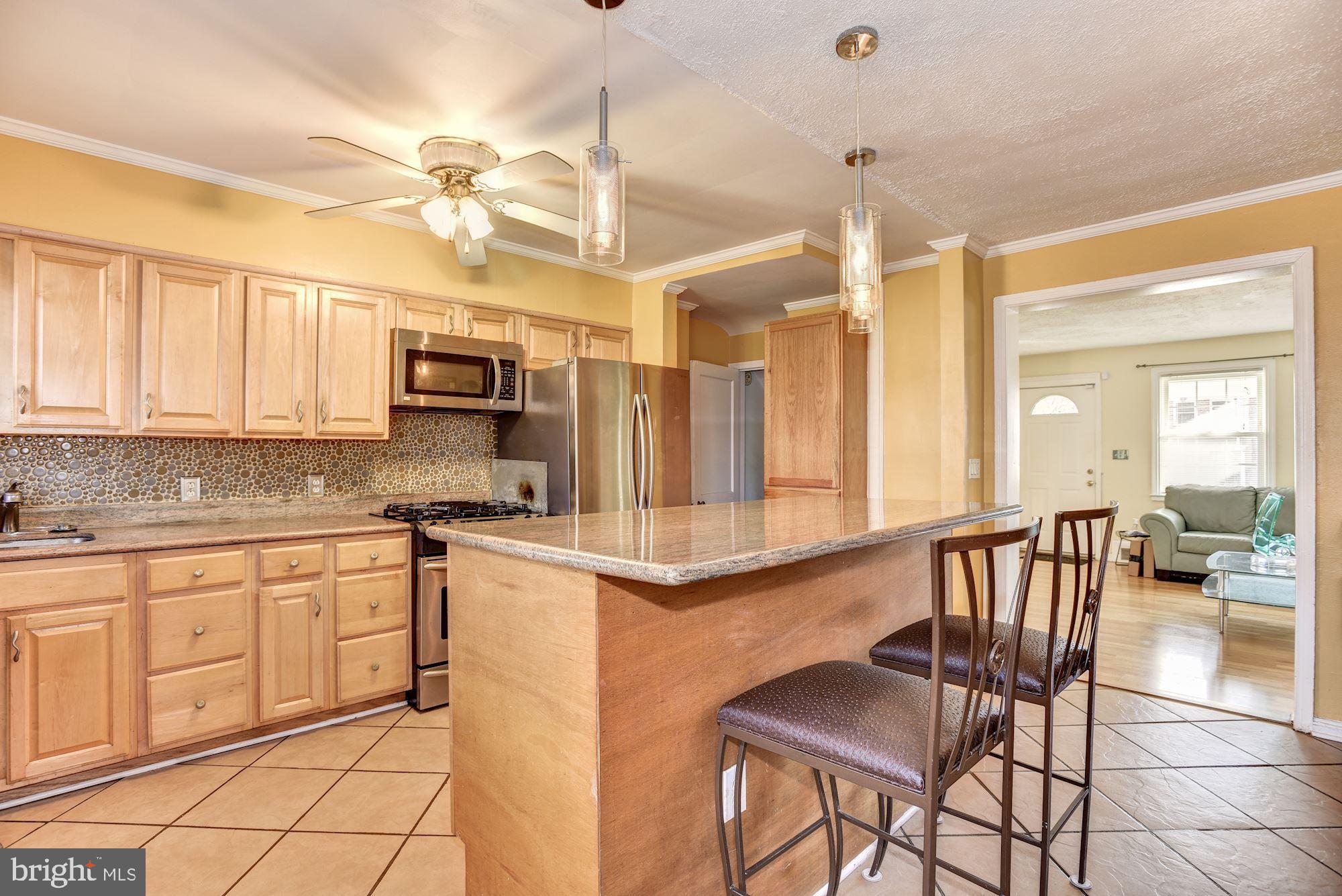 1320 Kitmore Road Baltimore, MD 21239 - Photo 10 of 26 Breakfast Bar | Granite Countertops