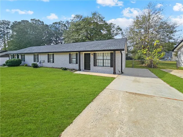 front view of a house with a yard