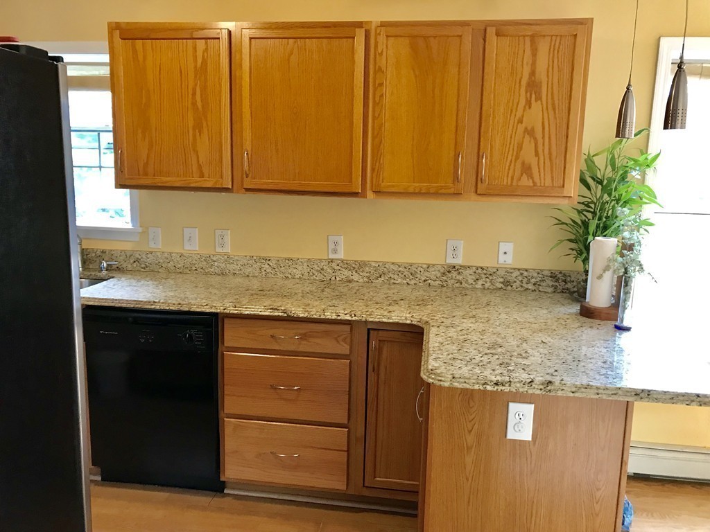 167 Orient Street Worcester, MA 01604 - Photo 11 of 29 a kitchen with granite countertop cabinets and window