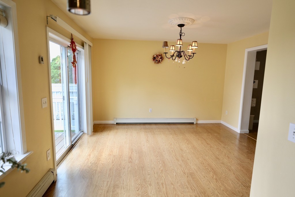 167 Orient Street Worcester, MA 01604 - Photo 12 of 29 a view of a livingroom with a furniture wooden floor and a window