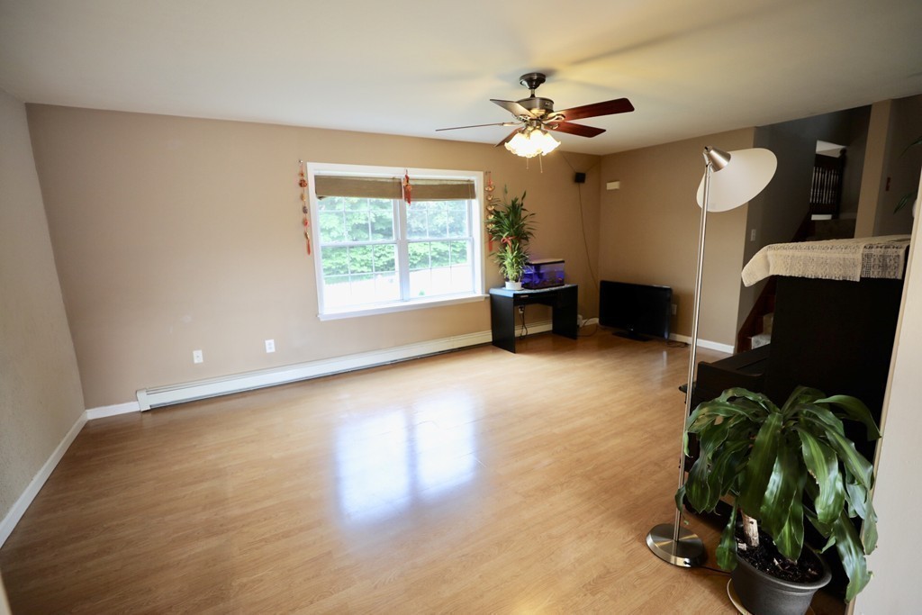 167 Orient Street Worcester, MA 01604 - Photo 13 of 29 a living room with furniture and a large window
