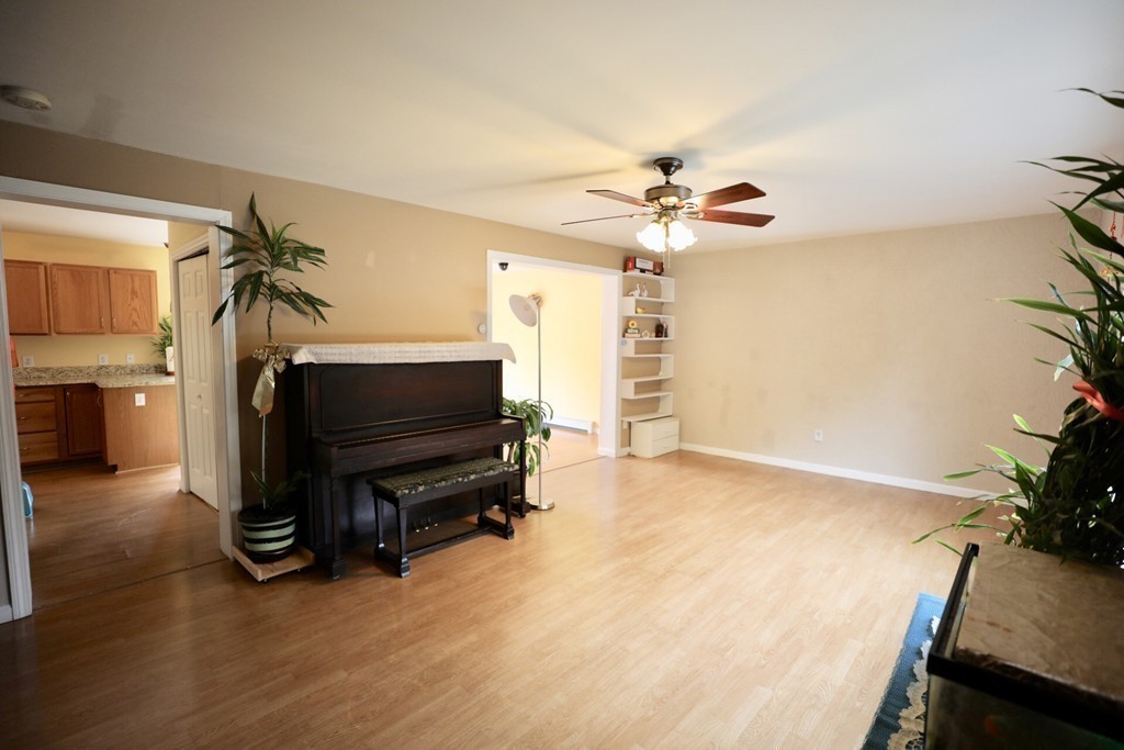 167 Orient Street Worcester, MA 01604 - Photo 14 of 29 a living room with furniture and a chandelier