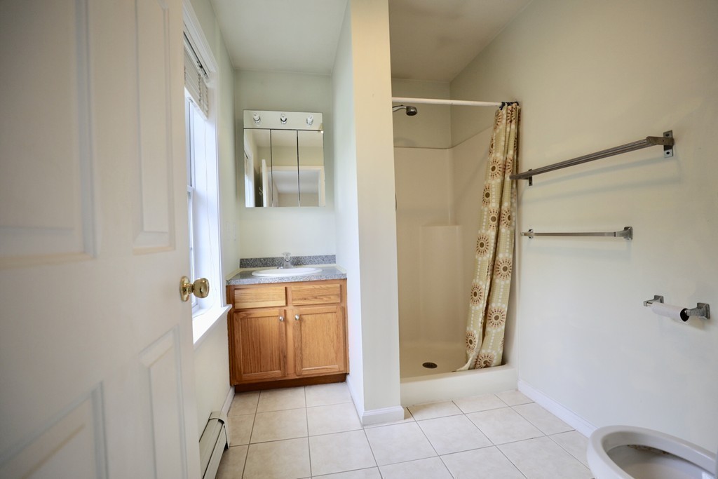 167 Orient Street Worcester, MA 01604 - Photo 17 of 29 a bathroom with a shower and a sink