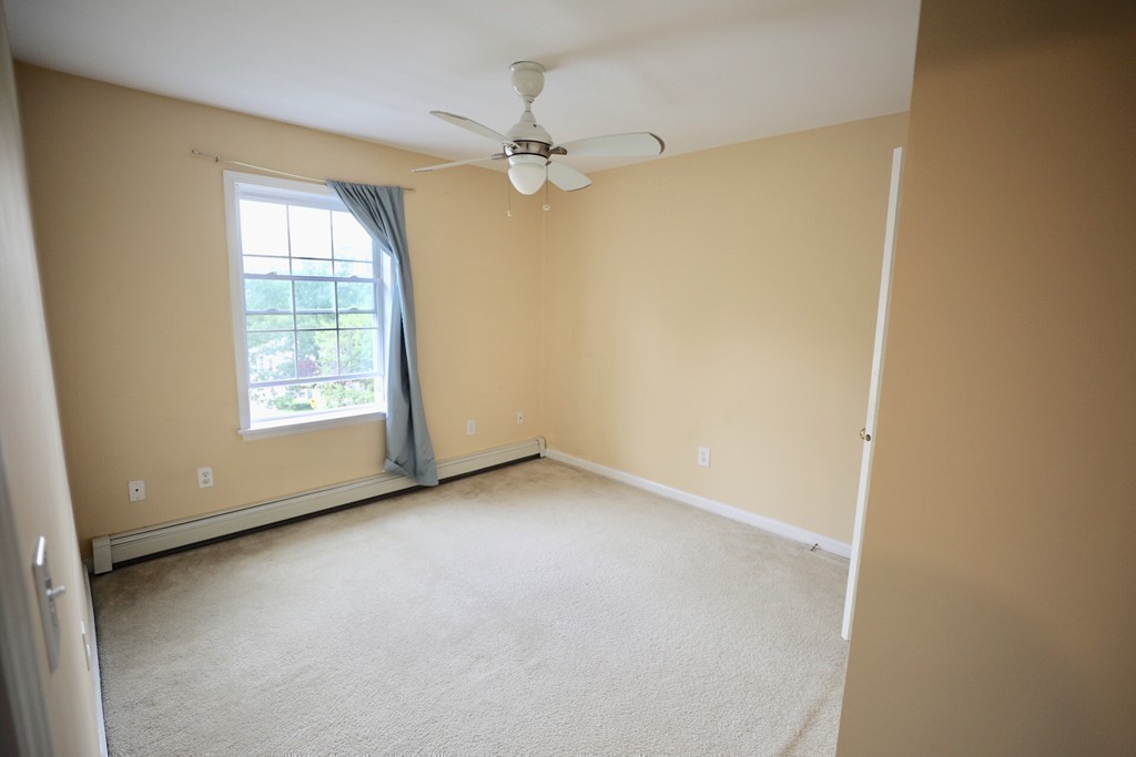 167 Orient Street Worcester, MA 01604 - Photo 19 of 29 an empty room with windows and fan