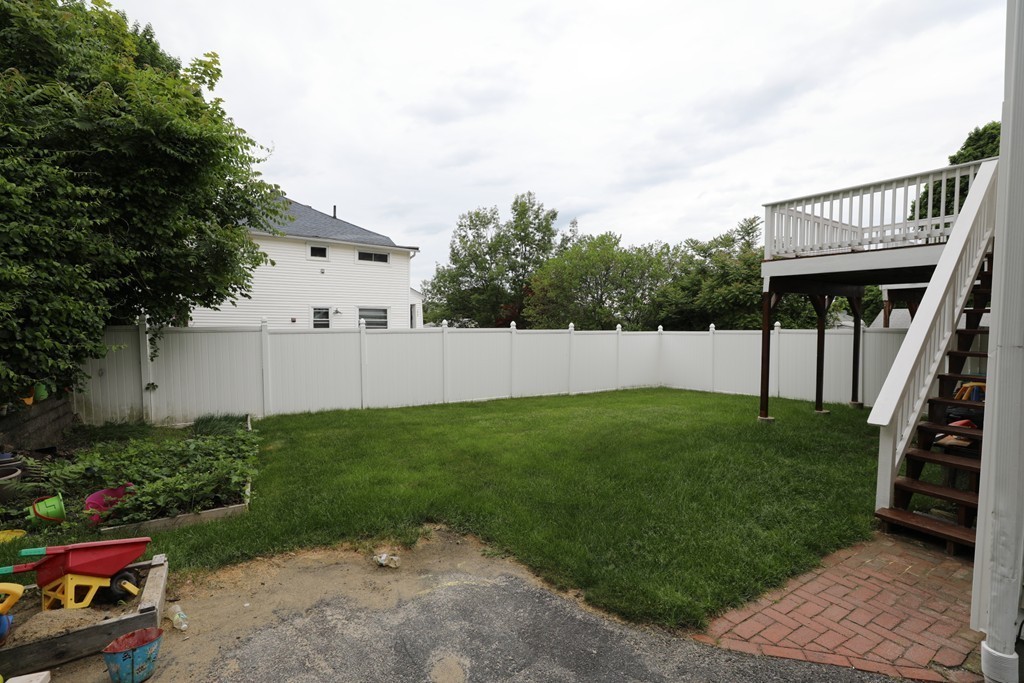 167 Orient Street Worcester, MA 01604 - Photo 6 of 29 a view of a backyard with plants and a garden
