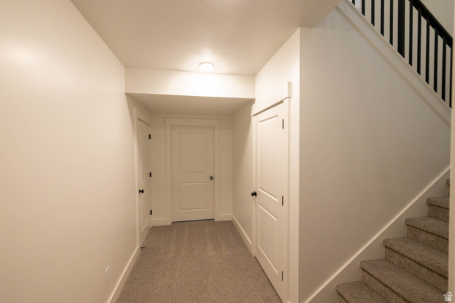 293 North Pheasant Drive Mapleton, UT 84664 - Photo 16 of 20 Corridor featuring stairway and light colored carpet