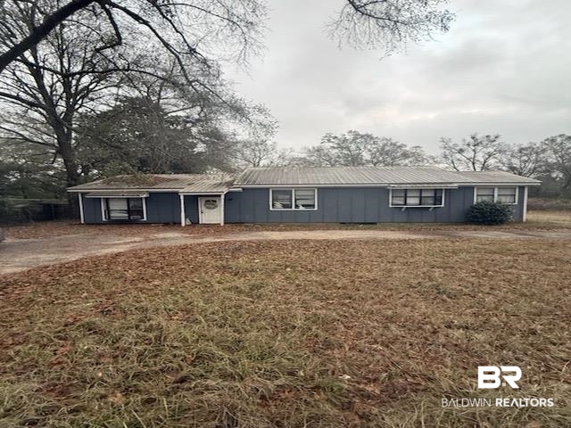 6745 Carol Plantation Road Theodore, AL 36582 - Photo 1 of 13 Ranch-style house with a front lawn and a metal roof