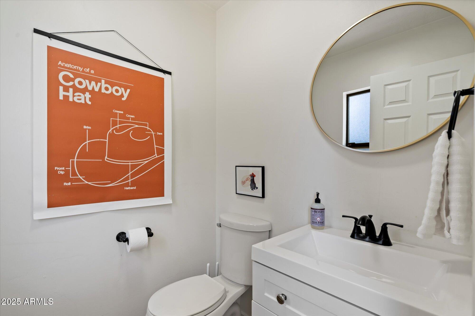 5701 East Charter Oak Road Scottsdale, AZ 85254 - Photo 17 of 27 a bathroom with a sink and a mirror
