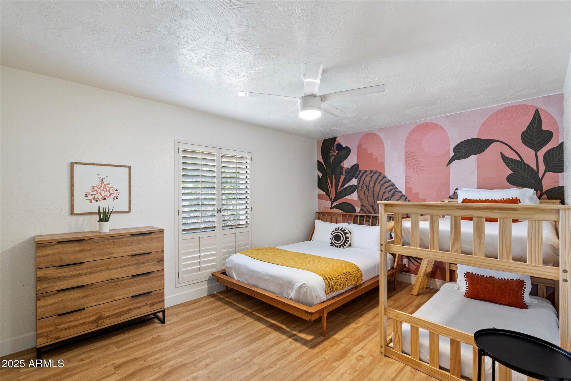 5701 East Charter Oak Road Scottsdale, AZ 85254 - Photo 18 of 27 a bedroom with a bed and furniture