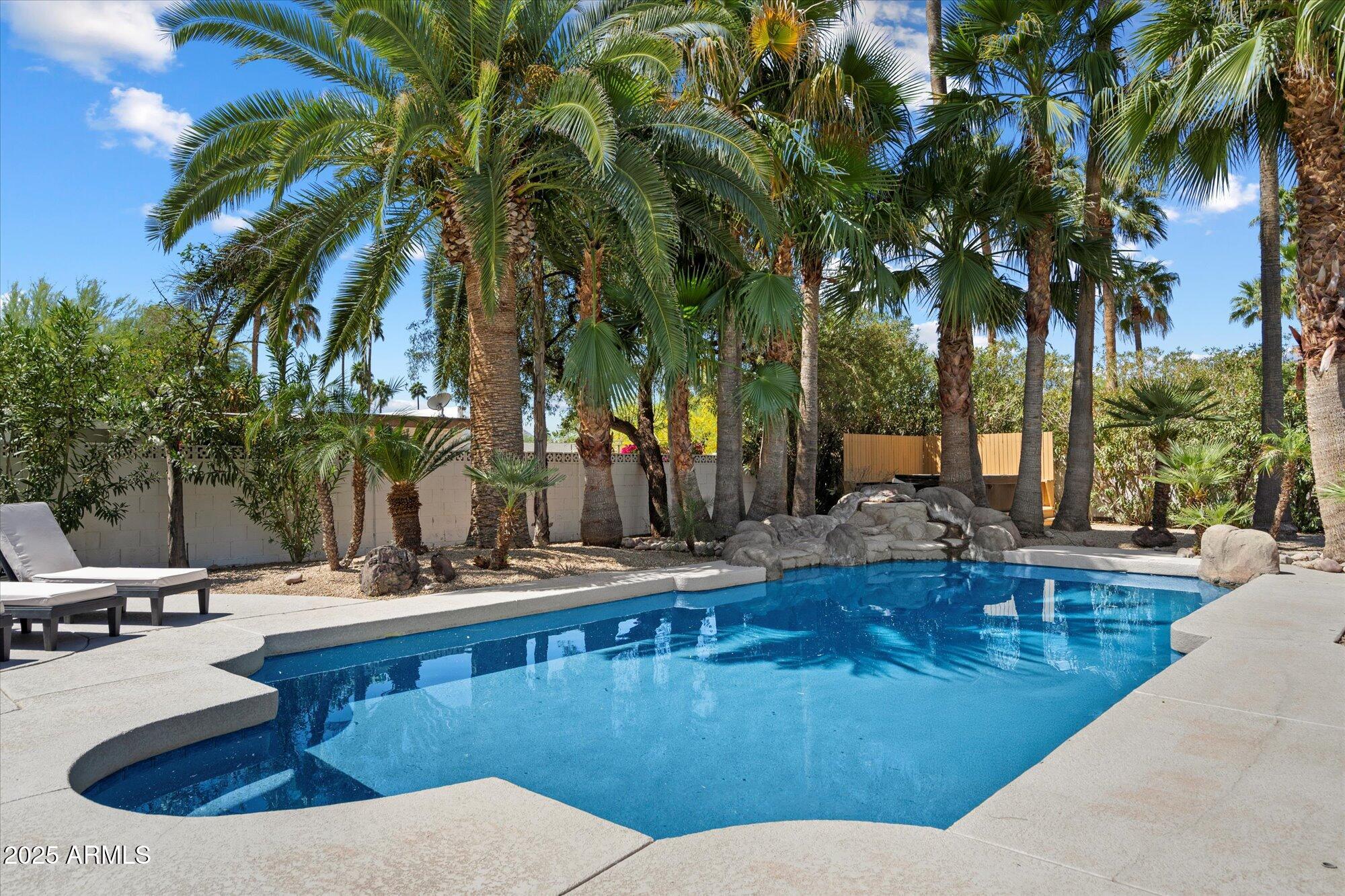 5701 East Charter Oak Road Scottsdale, AZ 85254 - Photo 25 of 27 a view of swimming pool with chairs