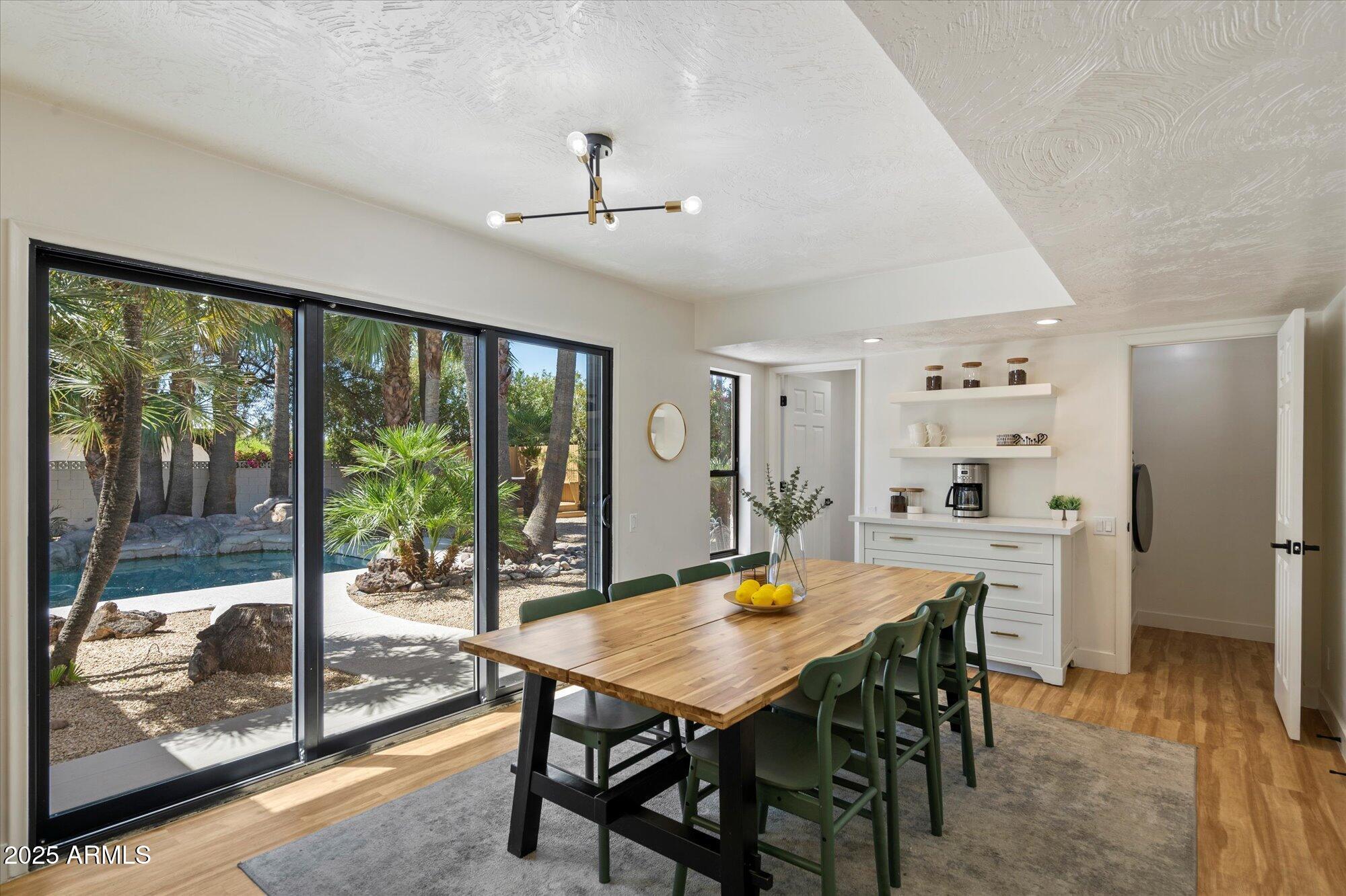 5701 East Charter Oak Road Scottsdale, AZ 85254 - Photo 9 of 27 a view of a dining room with furniture window and outside view