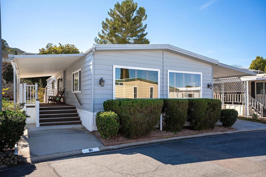 7467 Mission Gorge Road, Unit SPC 81 Santee, CA 92071 - Photo 1 of 36 a front view of a house with a yard
