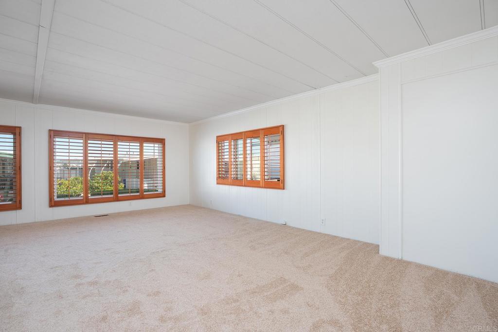 7467 Mission Gorge Road, Unit SPC 81 Santee, CA 92071 - Photo 17 of 36 an empty room with windows