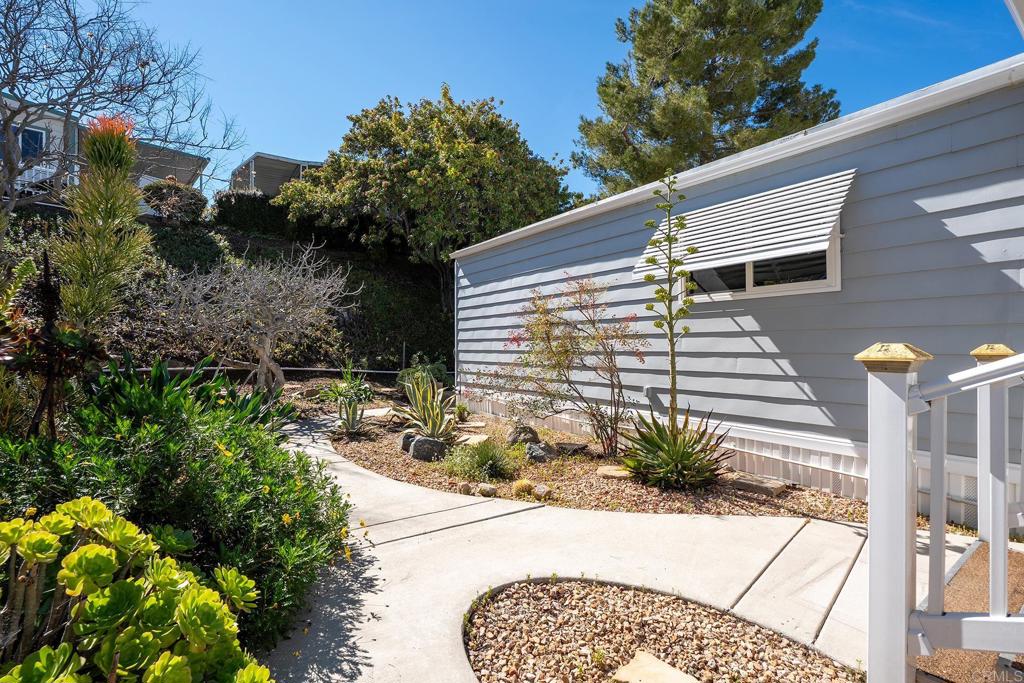 7467 Mission Gorge Road, Unit SPC 81 Santee, CA 92071 - Photo 2 of 36 a potted plant sitting in front of a house