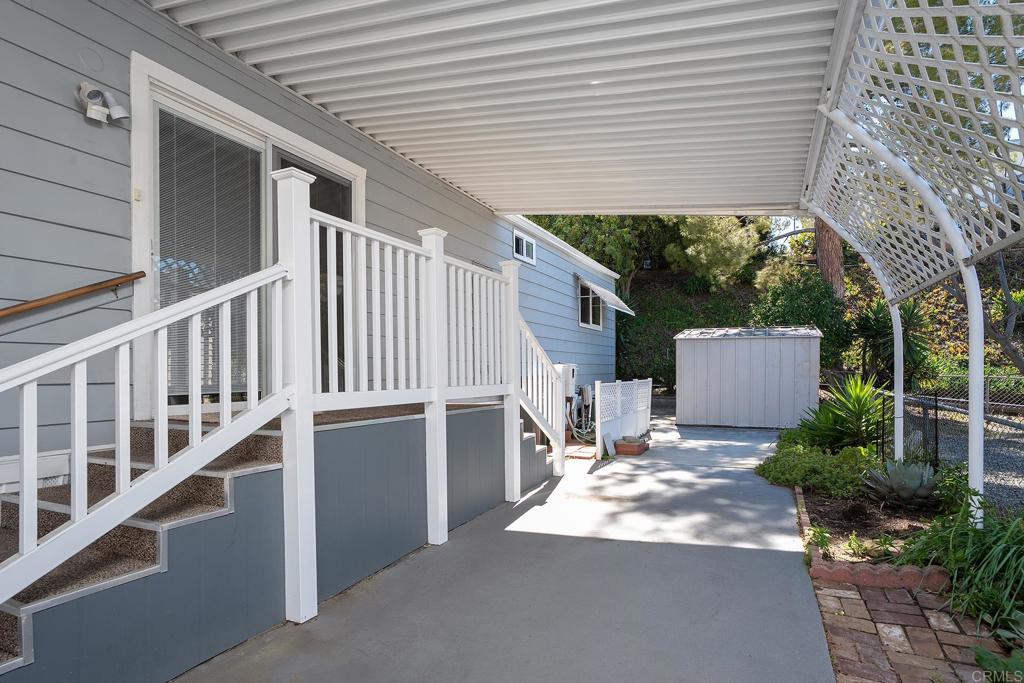 7467 Mission Gorge Road, Unit SPC 81 Santee, CA 92071 - Photo 21 of 36 a backyard of a house with wooden floor and fence