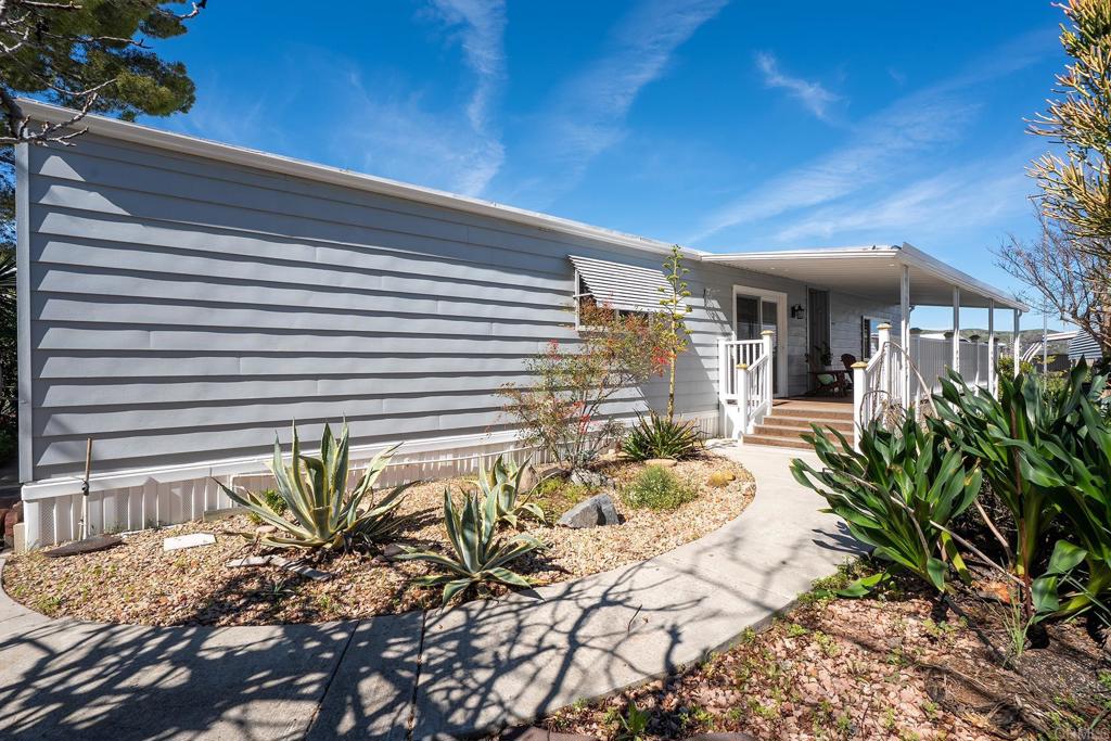 7467 Mission Gorge Road, Unit SPC 81 Santee, CA 92071 - Photo 23 of 36 a view of a house with a patio