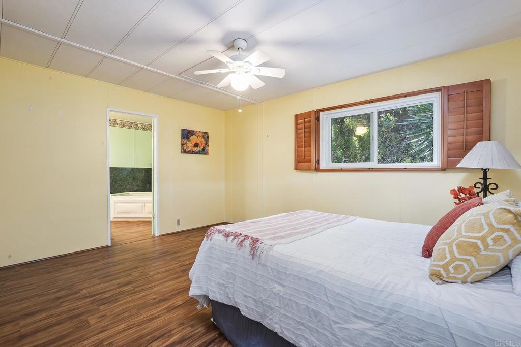 7467 Mission Gorge Road, Unit SPC 81 Santee, CA 92071 - Photo 26 of 36 a bedroom with a bed and a window