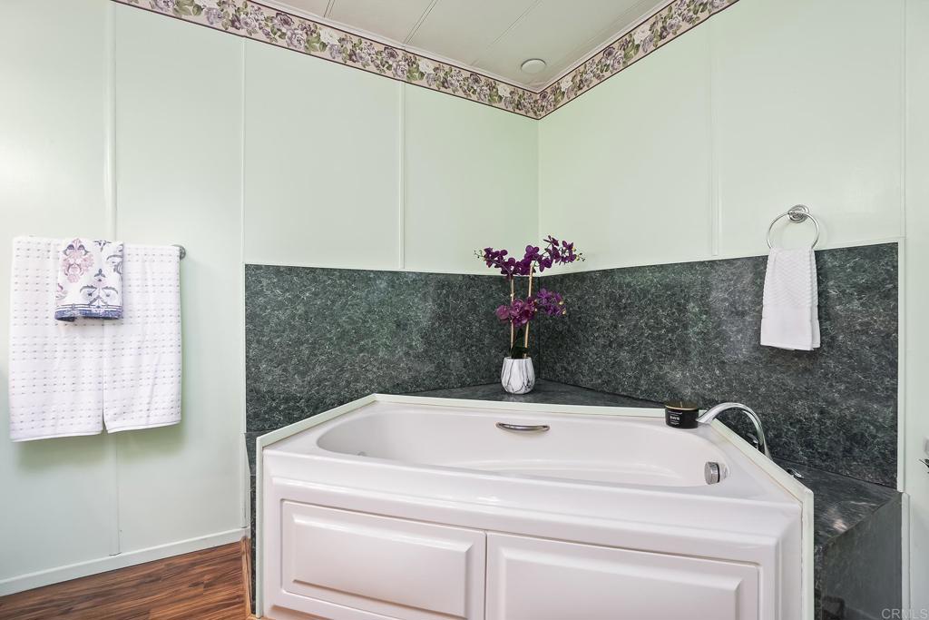 7467 Mission Gorge Road, Unit SPC 81 Santee, CA 92071 - Photo 28 of 36 a bathroom with a sink and a mirror