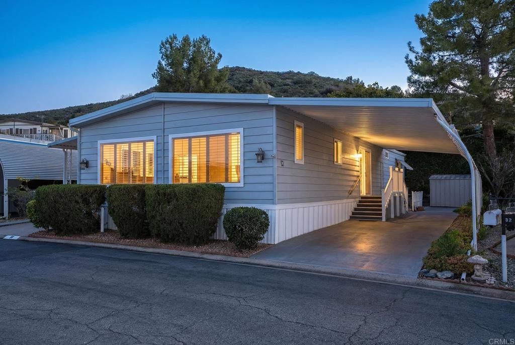 7467 Mission Gorge Road, Unit SPC 81 Santee, CA 92071 - Photo 3 of 36 a front view of a house with a yard