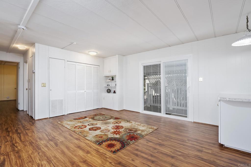 7467 Mission Gorge Road, Unit SPC 81 Santee, CA 92071 - Photo 32 of 36 a view of a livingroom with wooden floor