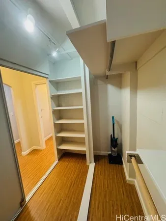 a view of bedroom and wooden floor