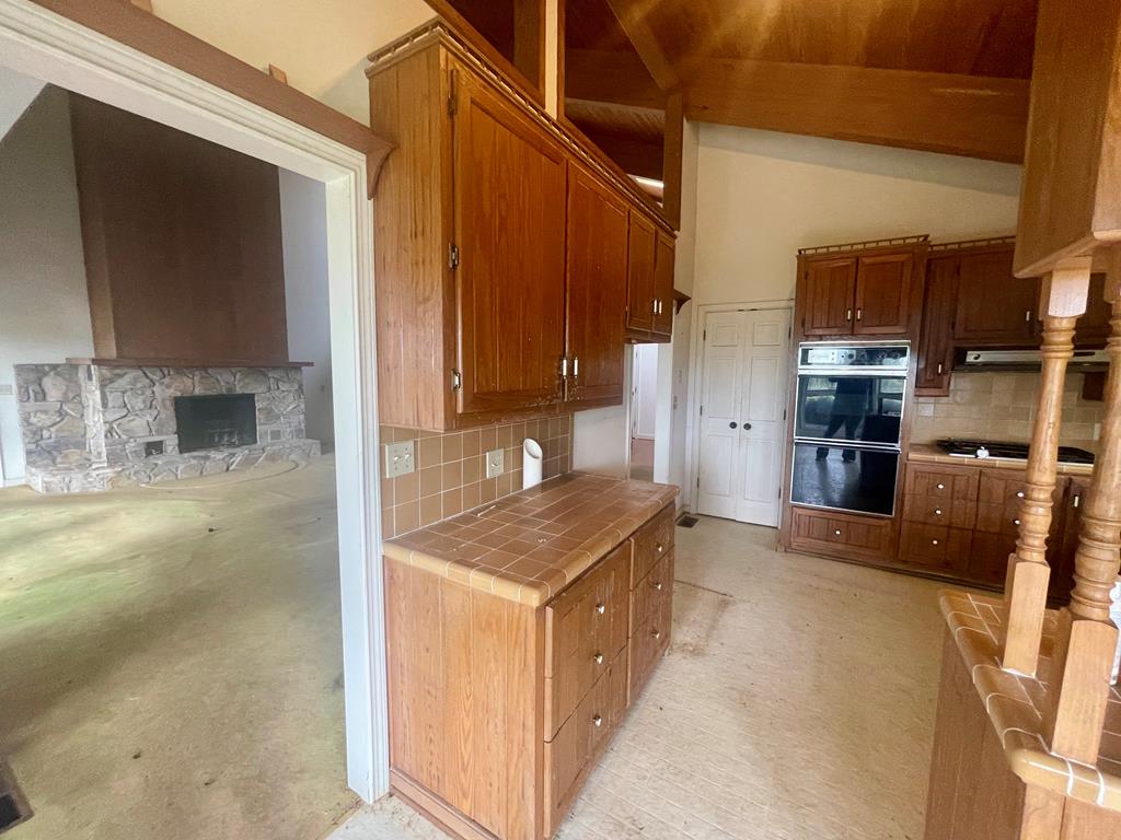 574 Old Chipley Road Pine Mountain, GA 31822 - Photo 12 of 61 a kitchen with stainless steel appliances granite countertop a sink stove and a refrigerator