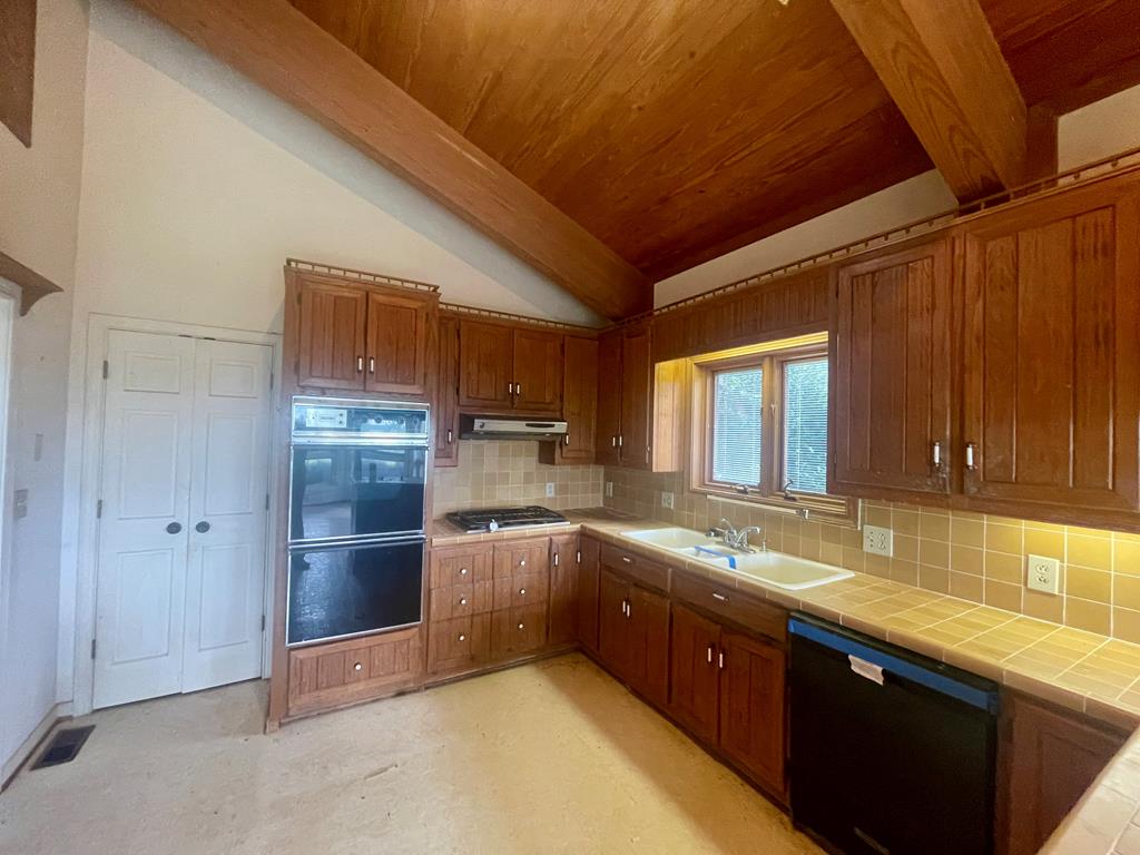 574 Old Chipley Road Pine Mountain, GA 31822 - Photo 13 of 61 a kitchen with stainless steel appliances granite countertop a sink and cabinets