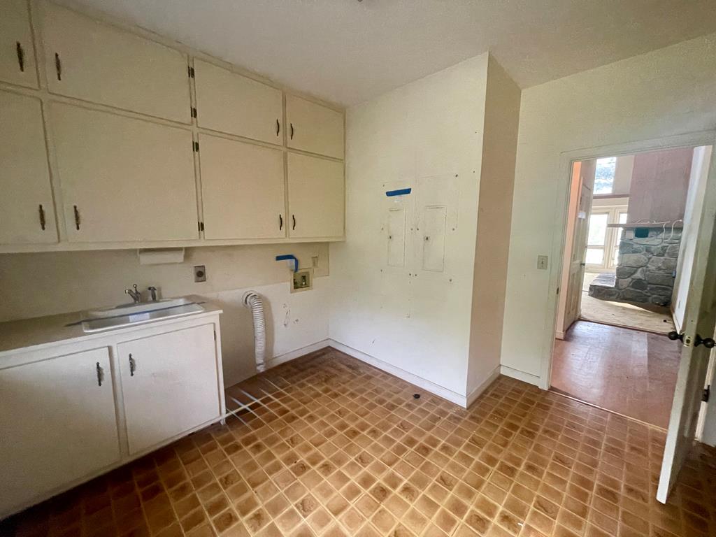 574 Old Chipley Road Pine Mountain, GA 31822 - Photo 16 of 61 a kitchen with a sink and cabinets