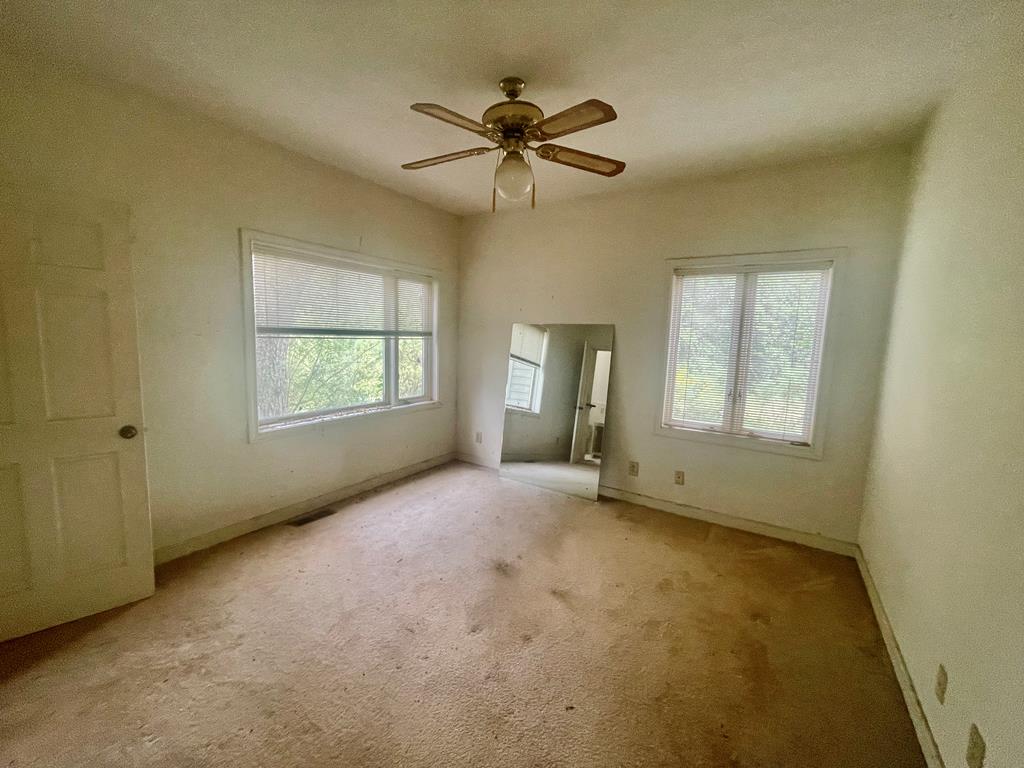 574 Old Chipley Road Pine Mountain, GA 31822 - Photo 18 of 61 a view of an empty room with a window