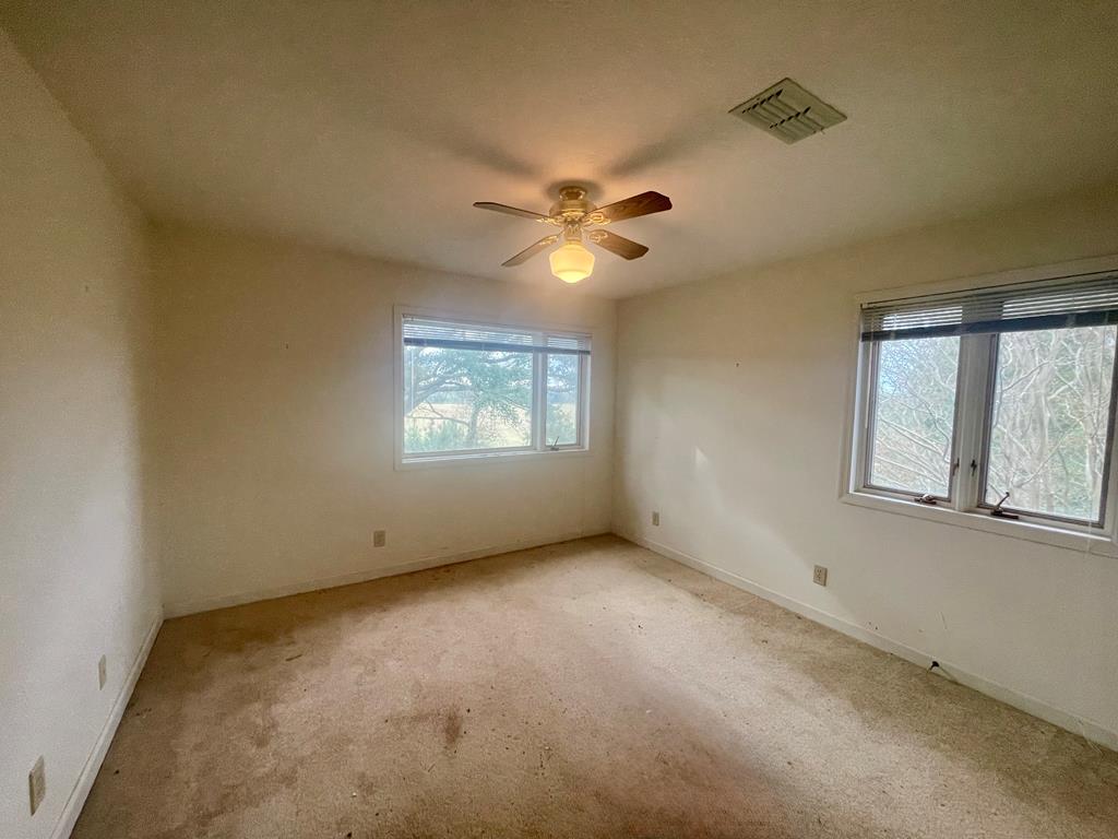 574 Old Chipley Road Pine Mountain, GA 31822 - Photo 40 of 61 an empty room with windows and fan