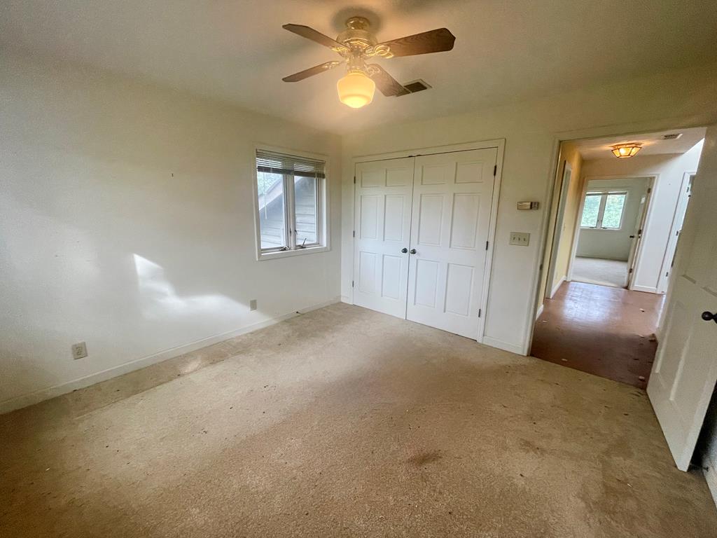 574 Old Chipley Road Pine Mountain, GA 31822 - Photo 41 of 61 a view of a big room with chandelier fan and windows