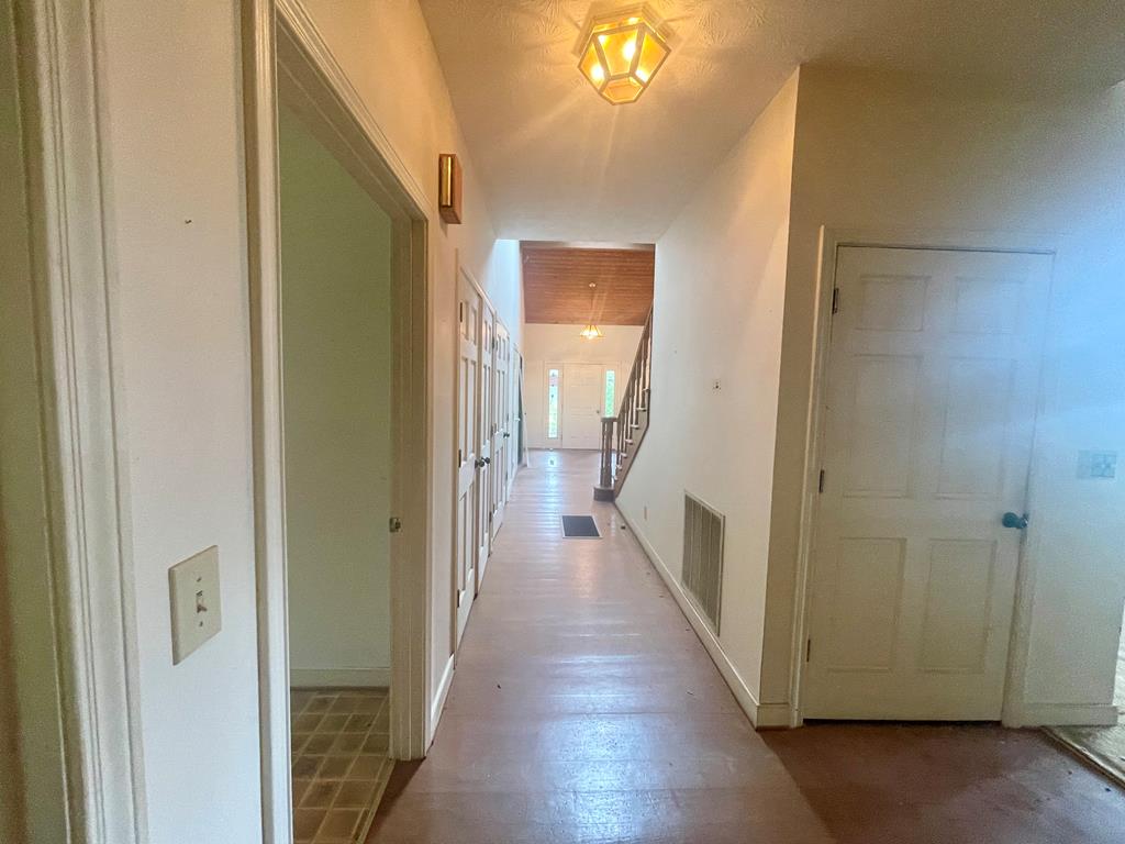 574 Old Chipley Road Pine Mountain, GA 31822 - Photo 47 of 61 a view of a hallway with wooden floor and a bathroom