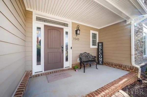 a front view of a house with a yard and a garage