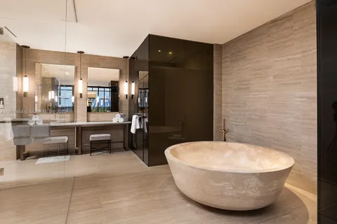 a living room with a couch and a potted plant