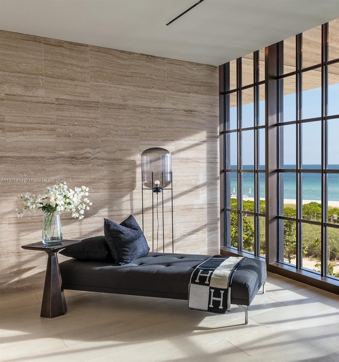 8955 Collins Avenue, Unit 402 Surfside, FL 33154 - Photo 14 of 20 a living room with furniture and a floor to ceiling window