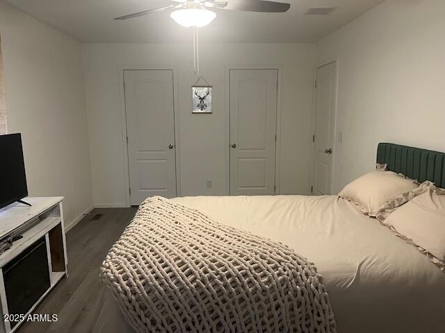 2000 South Apache Road, Unit 296 Buckeye, AZ 85326 - Photo 11 of 23 a bedroom with a bed and a computer on the desk