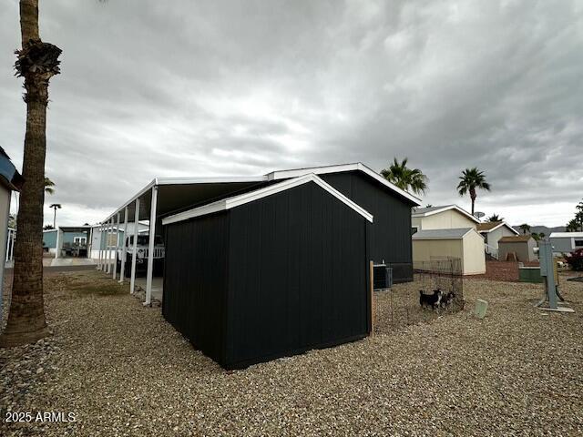 2000 South Apache Road, Unit 296 Buckeye, AZ 85326 - Photo 18 of 23 a backyard of a house with table and chairs