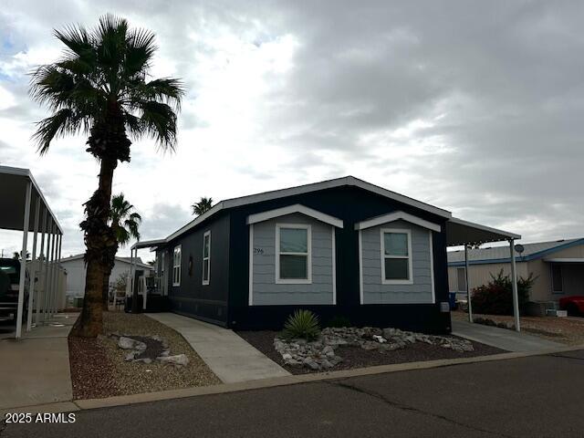 2000 South Apache Road, Unit 296 Buckeye, AZ 85326 - Photo 2 of 23 a front view of a house with a yard