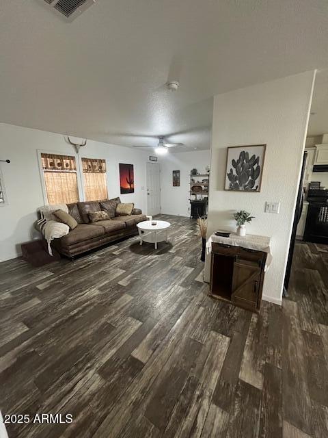 2000 South Apache Road, Unit 296 Buckeye, AZ 85326 - Photo 3 of 23 a living room with furniture and a wooden floor