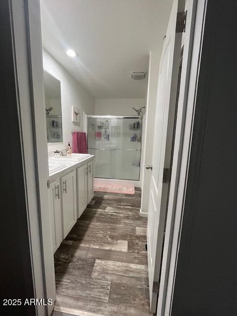 2000 South Apache Road, Unit 296 Buckeye, AZ 85326 - Photo 7 of 23 a bathroom with a sink a mirror and a shower