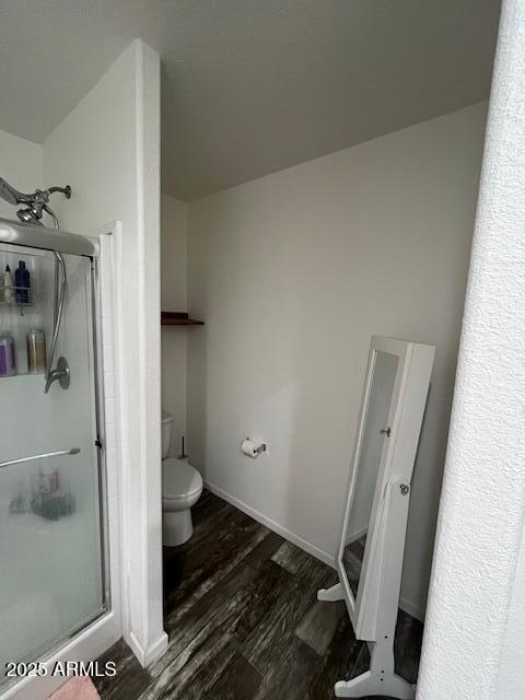 2000 South Apache Road, Unit 296 Buckeye, AZ 85326 - Photo 8 of 23 a bathroom with a granite countertop shower and a toilet