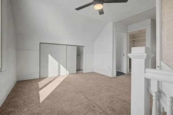 a kitchen with cabinets stainless steel appliances and a counter space