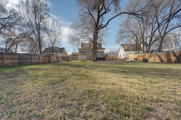 a backyard of a house with lots of green space