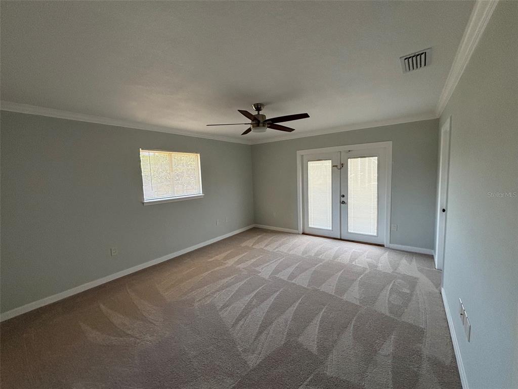 9801 Southeast Sunset Harbor Road Summerfield, FL 34491 - Photo 9 of 37 a view of an empty room with a window